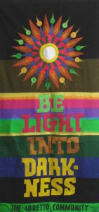 Banner designed by Robert Strobridge with starburst and phrase "Be Light Into Darkness."