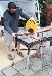 Mike Martin deconstructs a rifle. (Photo courtesy of Pat Geier)