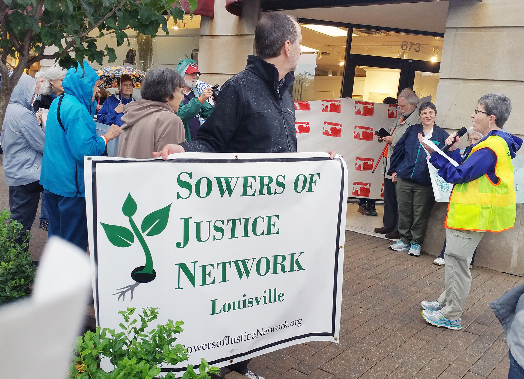 At right, Pat Geier speaks to participants in a prayerful march for solutions to gun violence. The march was led by the Sowers of Justice Network May 21 in Louisville. (Photo courtesy of Pat Geier)