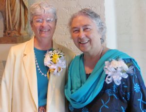 From left, Sue Charmley and Marie Ego are all smiles as they anticipate their golden jubilees later in May. (Photo by Peg Jacobs)