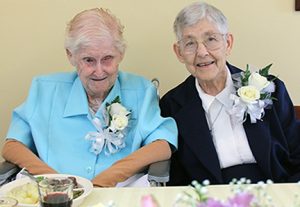 From left, diamond jubilarians Virginia Ann (V.A.) Driscoll and Theresa Louise Wiseman enjoy a festive celebration at the Motherhouse on Foundation Day. (Photo by Peg Jacobs)