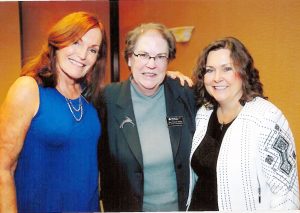 Mary Catherine Rabbitt is pictured with two of her co-workers.  At left is Vinni Ferrara.  At right is Anne Meier. (Photo courtesy of Mary Catherine Rabbitt)