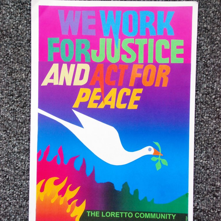 Colorful artwork with the text "We work for justice and act for peace." A white dove carrying an olive branch in its mouth is below. Art by Bob Strobridge.