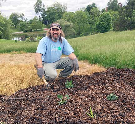 Gary Libby from Skybax Ecological Services helps to convert a portion of the Motherhouse lawn above Badin Pond to pollinator habitat.