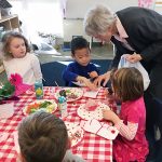 Bernie Feeney SL talks with elementary children