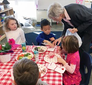 Bernie Feeney SL talks with elementary children