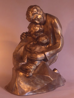 “Caress,” a composition cast in bronze by Loretto artist Jeanne Dueber