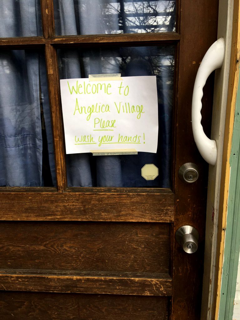 Door with a welcome note taped to it