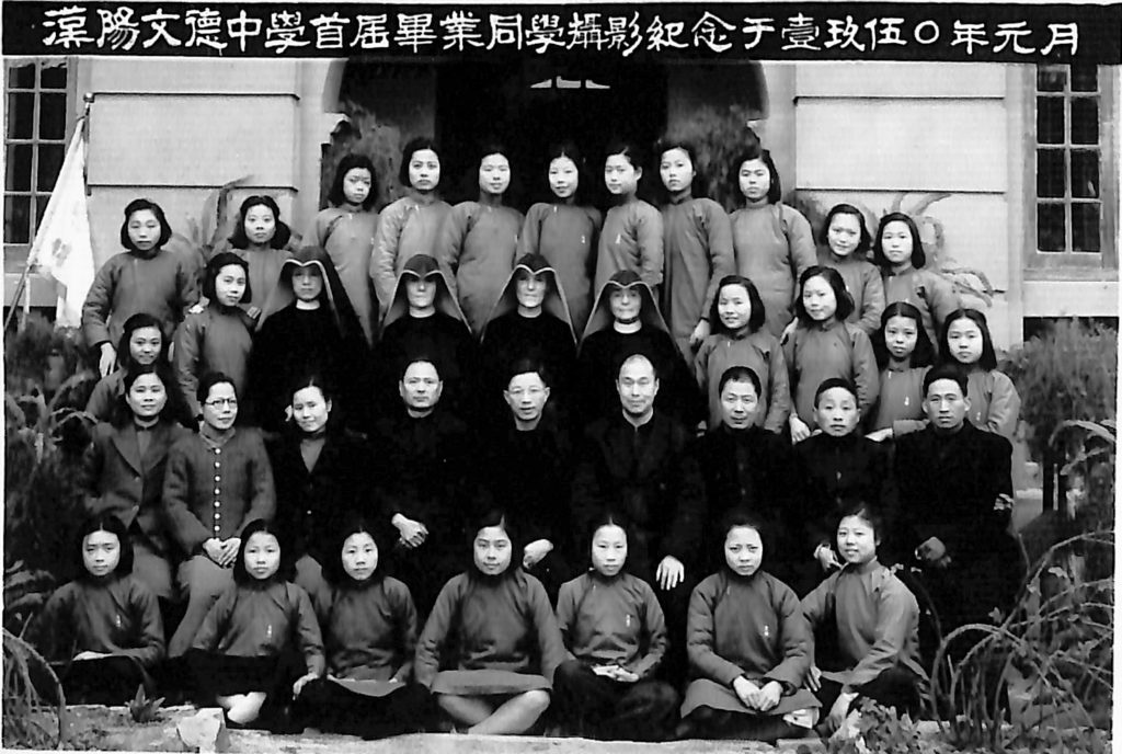 Archival class photo from China, with Sisters of Loretto, in habit, in the center.