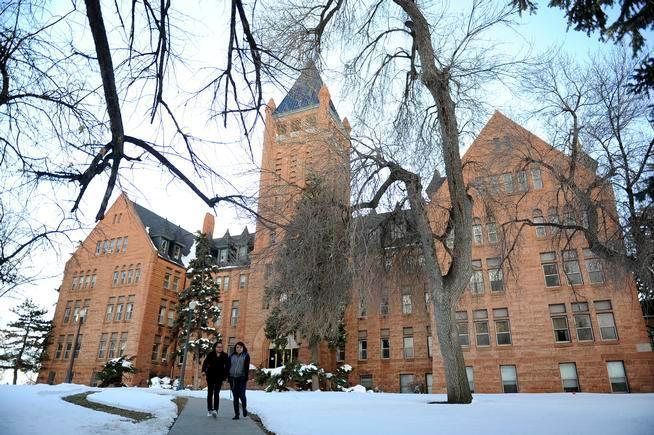 Two students walking on a winter campus