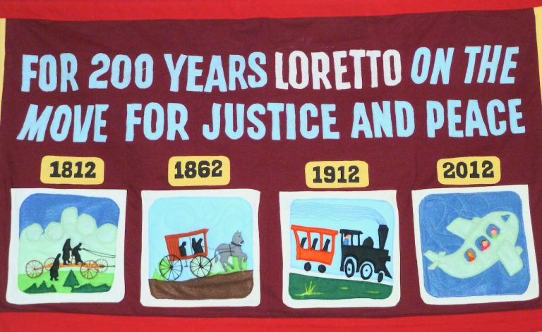 Banner reads "For 200 years Loretto on the move for justice and peace."