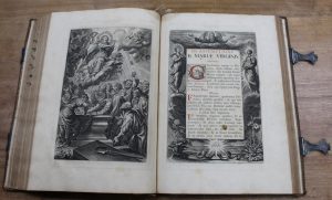 Two pages of an antique book displaying biblical images and text.
