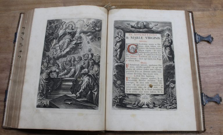 Two pages of an antique book displaying biblical images and text.