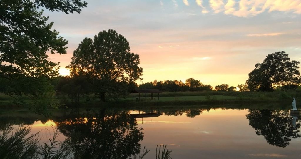 The sunrise puts the landscape into profile at Baden Pond at the Loretto Motherhouse.