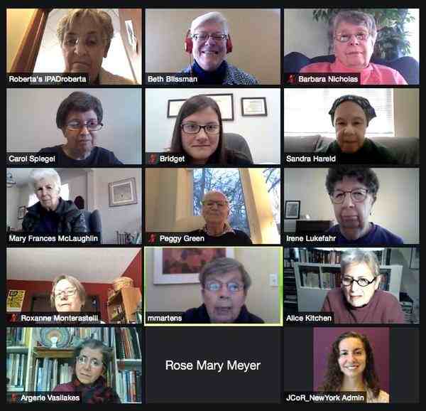 Screenshot from Zoom meeting of 15 people in their "Zoom boxes"