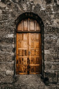 brown wooden door close up photography