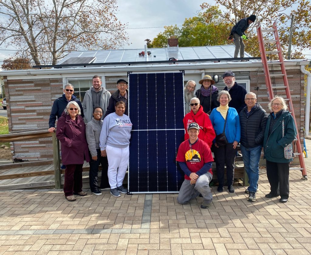 Supporters of the Shenandoah Valley Black Heritage Center gather to install solar panels funded in part by the Loretto Carbon Reduction Fund. Photo by Jeff Heie