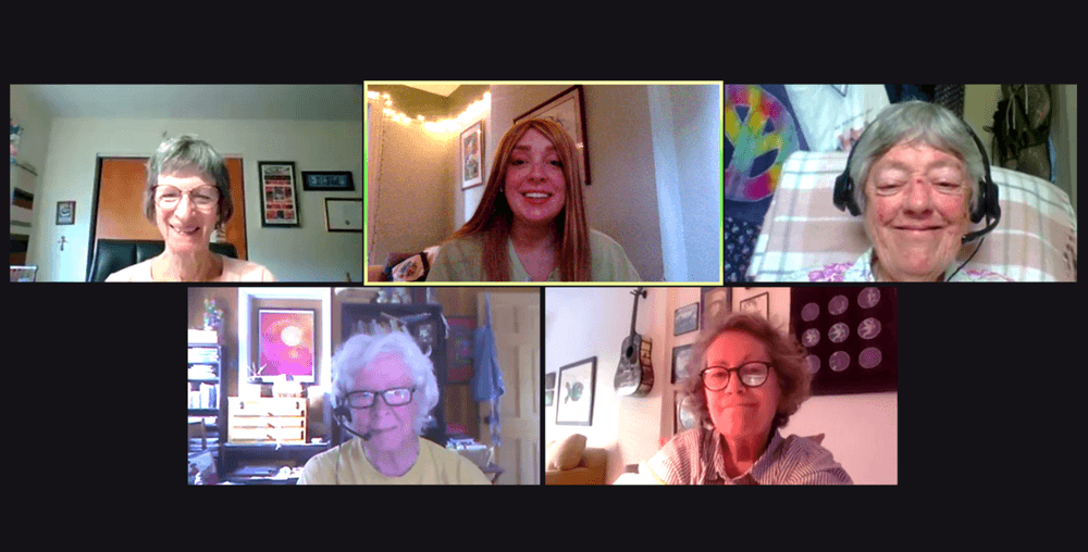 Five women conversing in their personal spaces via web-call.