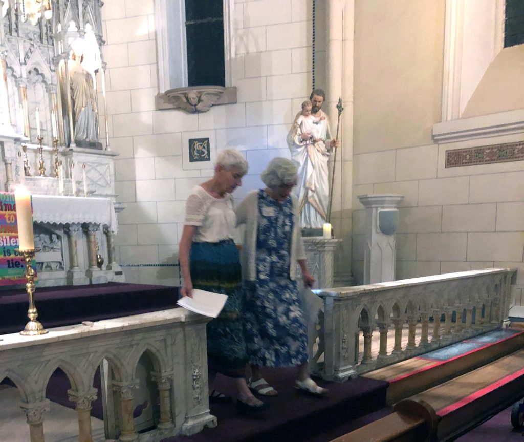Mary Margaret Murphy and Allison descend the steps together after Mary Margaret had accepted Allison’s commitment and welcomed her on behalf of Barbara Nicholas and the Loretto Community.