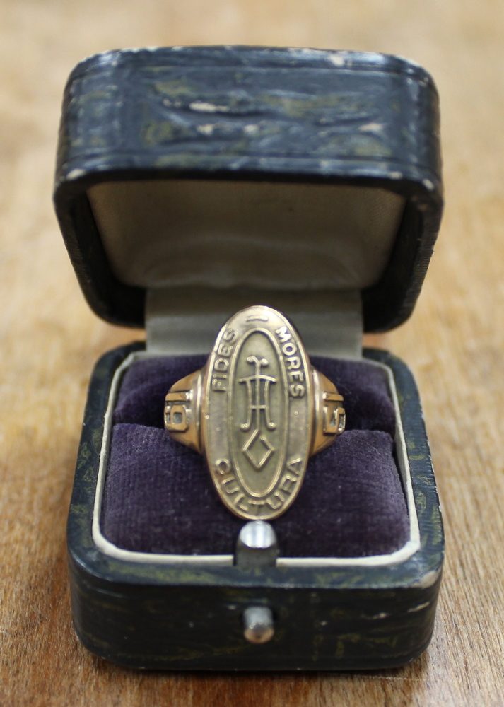 Class ring from Loretto Academy on display in a ring box.