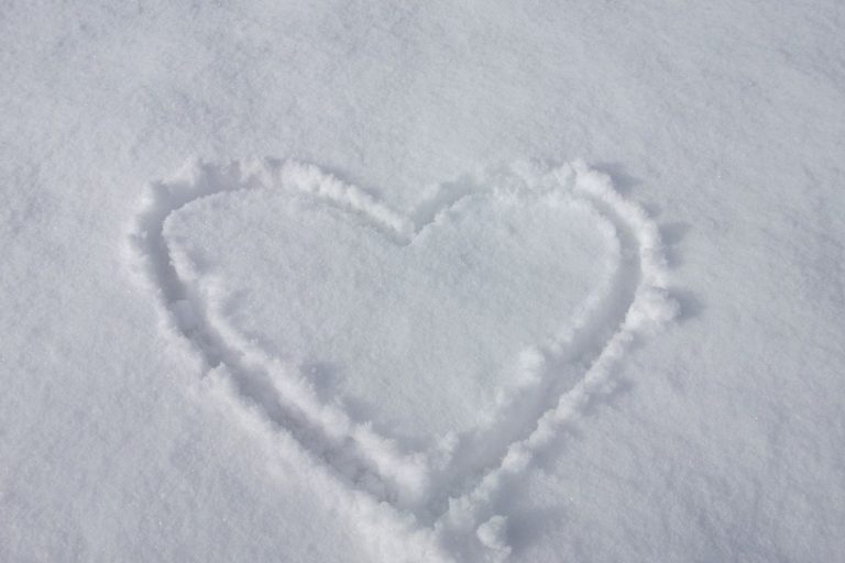 Heart, love symbol on beach