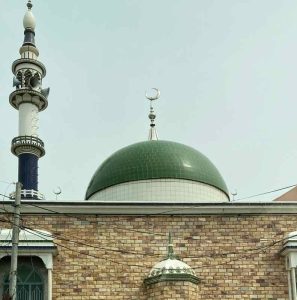 The dome and call tower of a mosque.