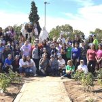 Group shot of participants at a outside work day at Loretto Academy in El Paso, TX