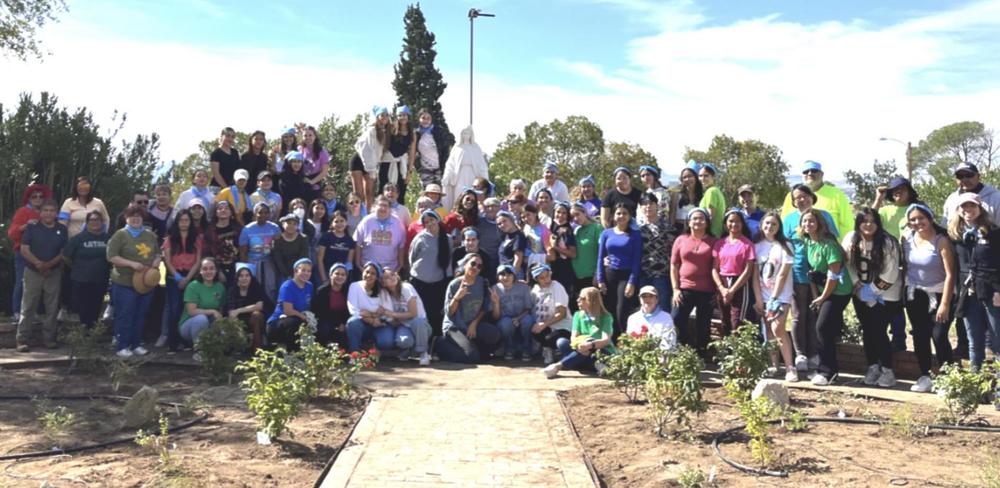 Group shot of participants at a outside work day at Loretto Academy in El Paso, TX