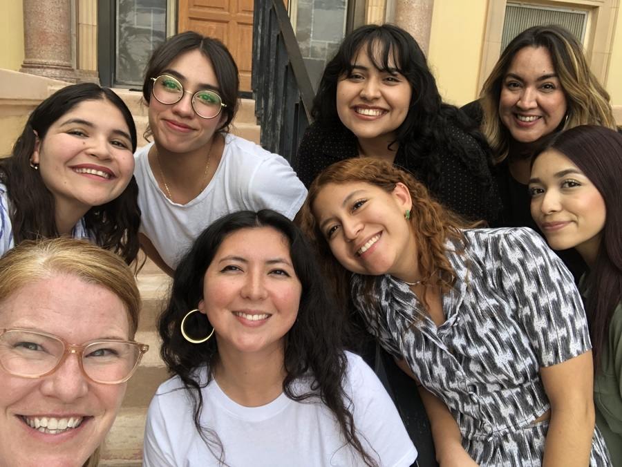 Selfie of eight women of diverse ethnicity.