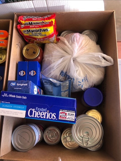a box of canned and boxed pantry food