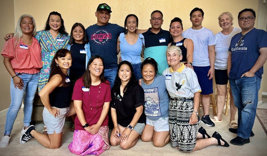 A group of adult Vietnamese adoptees pose for a photo with the Sister of Loretto who served at the orphanage in Vietnam.