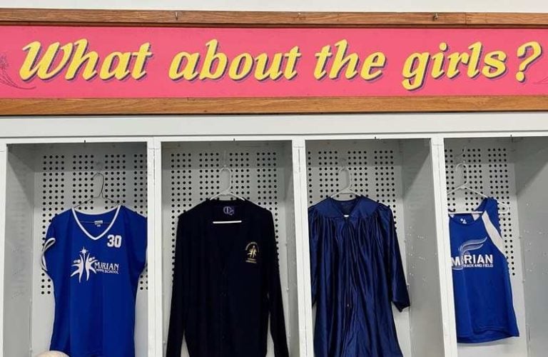 The quote "What about the girls?" is displayed above Marian Middle School sports and school uniforms and a graduation gown.