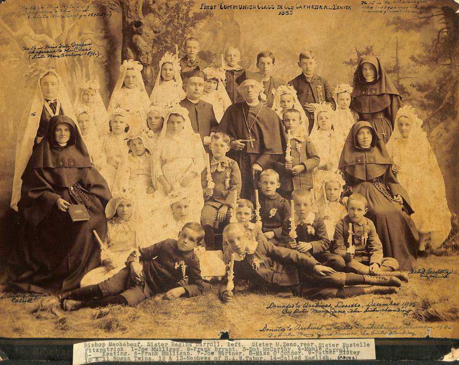 Archival photo in sepia tones of a first Communion class from 1885