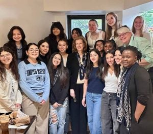 A group of high school students are pictured with an Irish diplomat at a coffee shop in New York during the 68th Commission on the Status of Women.