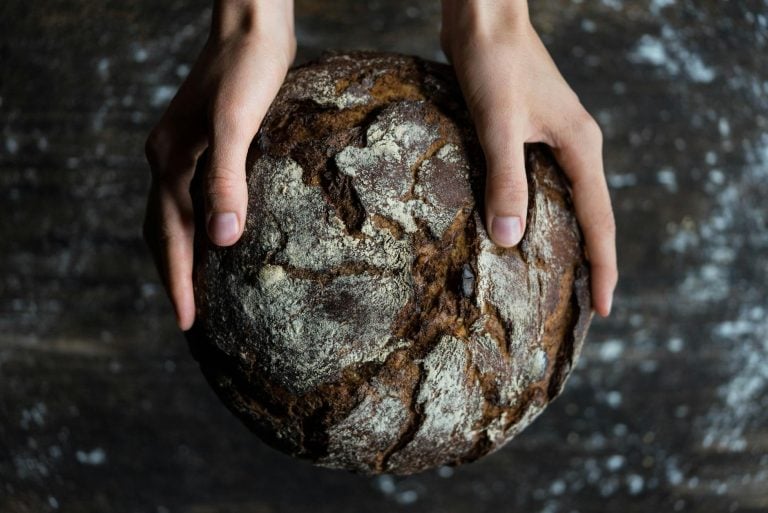 human holding a bread