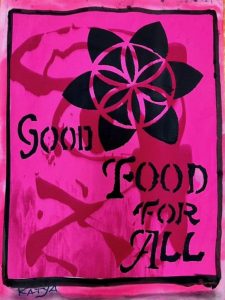 A pink poster seek at the United Nations Headquarters that says "Good Food for All"