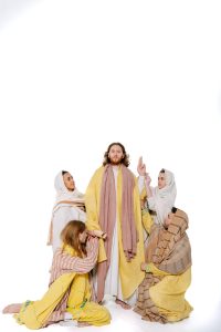 men and women in jesus christ and apostles costumes