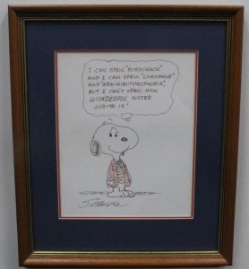 A framed original Snoopy cartoon, signed by Charles Schulz. Snoopy wears a coat and tie and his thought bubble reads "I can spell "Rorschach" and I can spell "Logophile" and "Arachibutyrophobia" but I can't spell how WONDERFUL Sister Judith is!"
