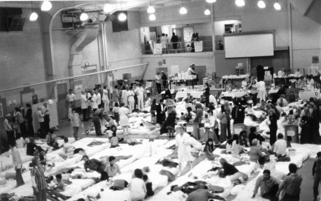 Rows of mattresses fill the gymnasium at the Presidio, a former military post in San Francisco, accommodating children airlifted from Vietnam in April 1975 as they awaited transport to adoptive families.