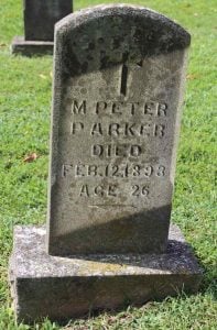 Gravestone bearing a cross, with the words, "M. Peter Parker. Died Feb. 12, 1893, Age 26"