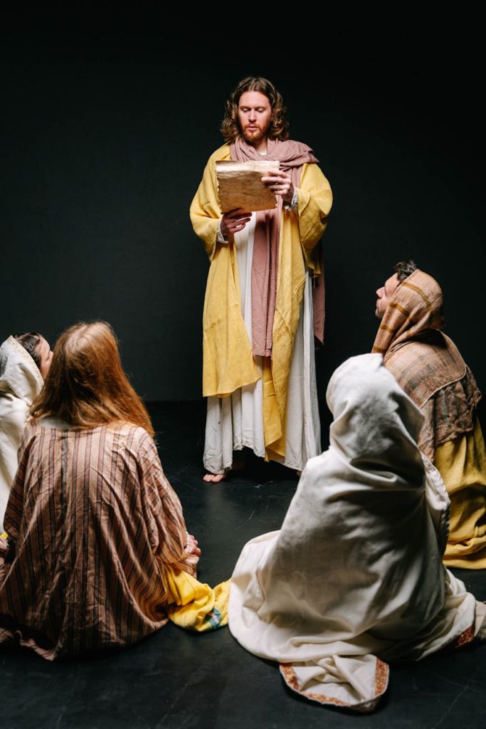man and people in jesus christ and apostles costumes