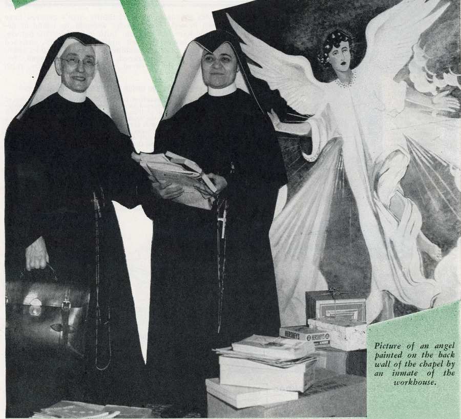Archival news photo of two habited nuns standing amidst piles of books in front of a large mural of an angel. Caption text in the lower right corner reads "Picture of an angel painted on the back wall of the chapel by an inmate of the workhouse."