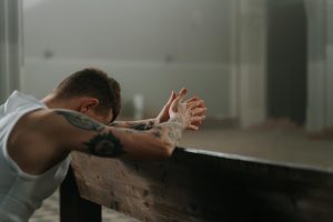 man praying solemnly