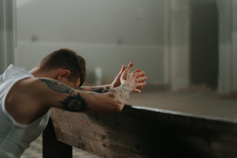 man praying solemnly