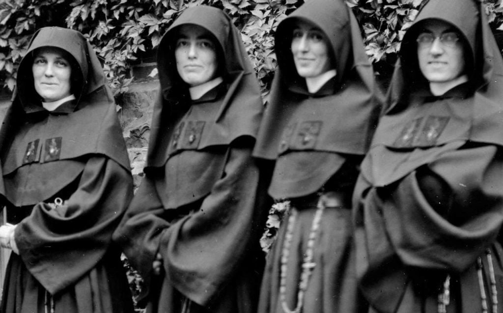 Four nuns in black habits posing for a photo in 1890. They were teachers at St. Mary's Academy.