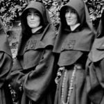 Four nuns in black habits posing for a photo in 1890. They were teachers at St. Mary's Academy.