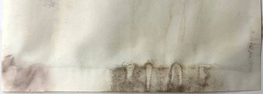 Paper with mildew stains on the bottom.
