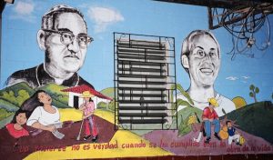 Colorful mural of St. Oscar Romero and Ann Manganaro with the text La muerte no es verdad cuando se ha cumplido bien la obra de la vida" (translation: "Death is not real when the work of life has been well fulfilled.")