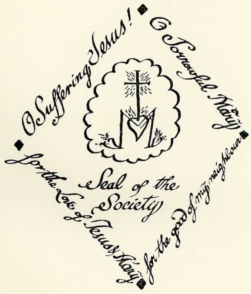 The Loretto seal that says "O Suffering Jesus! O Sorrowful Mary for the love of Jesus & Mary for the good of my neighbour" in a diamond shape. In the middle it says "Seal of the society"