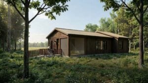 An image rendering of an accessible wooden cabin int he woods featuring a person in a wheelchair ramp entering the cabin.
